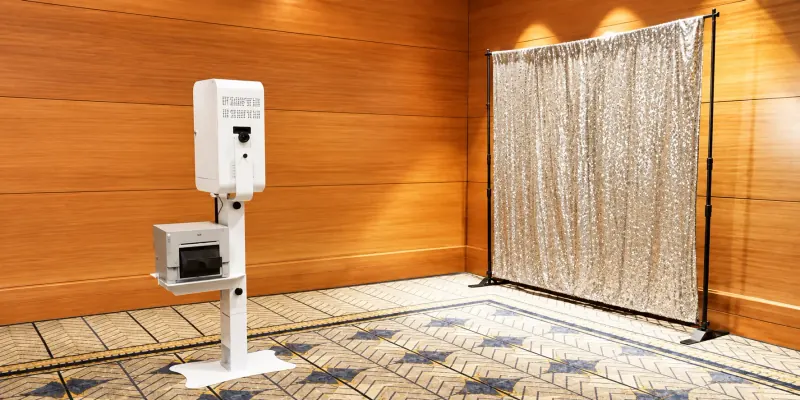 Open-air photo booth with a metallic backdrop